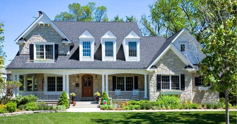 Newly finished roof on a white two-story Atlanta-area home